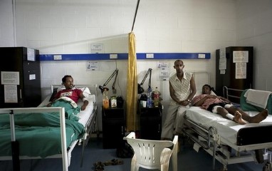 [Photo: Ethiopian citizen Micky Abebe (R) and Eritrean Samson Tesfai (L) both survivors of an explosion attack rest inside a ward at the International Hospital Kampala, July 12, 2010.]