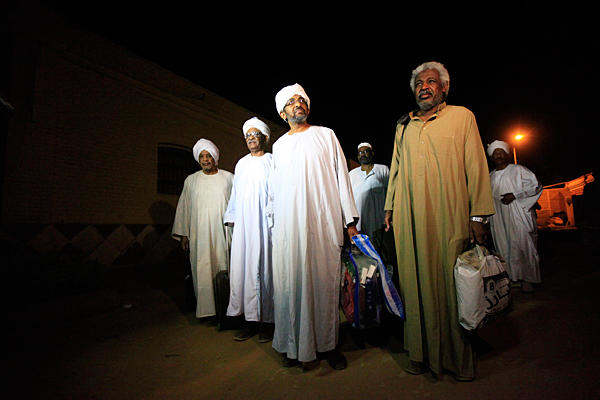 Political prisoners walk out after their release from Kober Prison in Khartoum, Sudan, Tuesday. Sudan's President Omar Hassan al-Bashir on Monday ordered the release of all political prisoners, a move cautiously welcomed by the opposition in the tightly-controlled African country.  (Mohamed Nureldin Abdallah/Reuters)